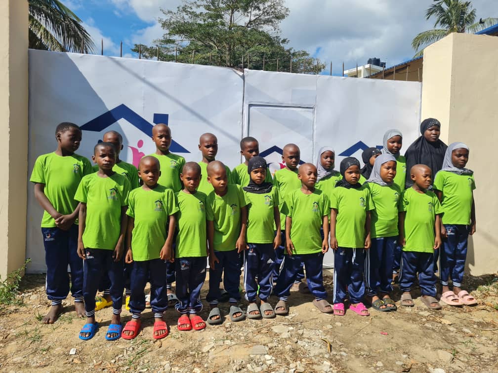 Muzammil Orphanage Center founders with community members